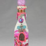 Whimsical beaded Genie bottle with a pink & blue butterfly adorning the front. 