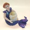 Mermaid Vessel. Sometimes the flotsam & jetsam you find is what makes life interesting. Polymer clay figure with beach glass vessel.